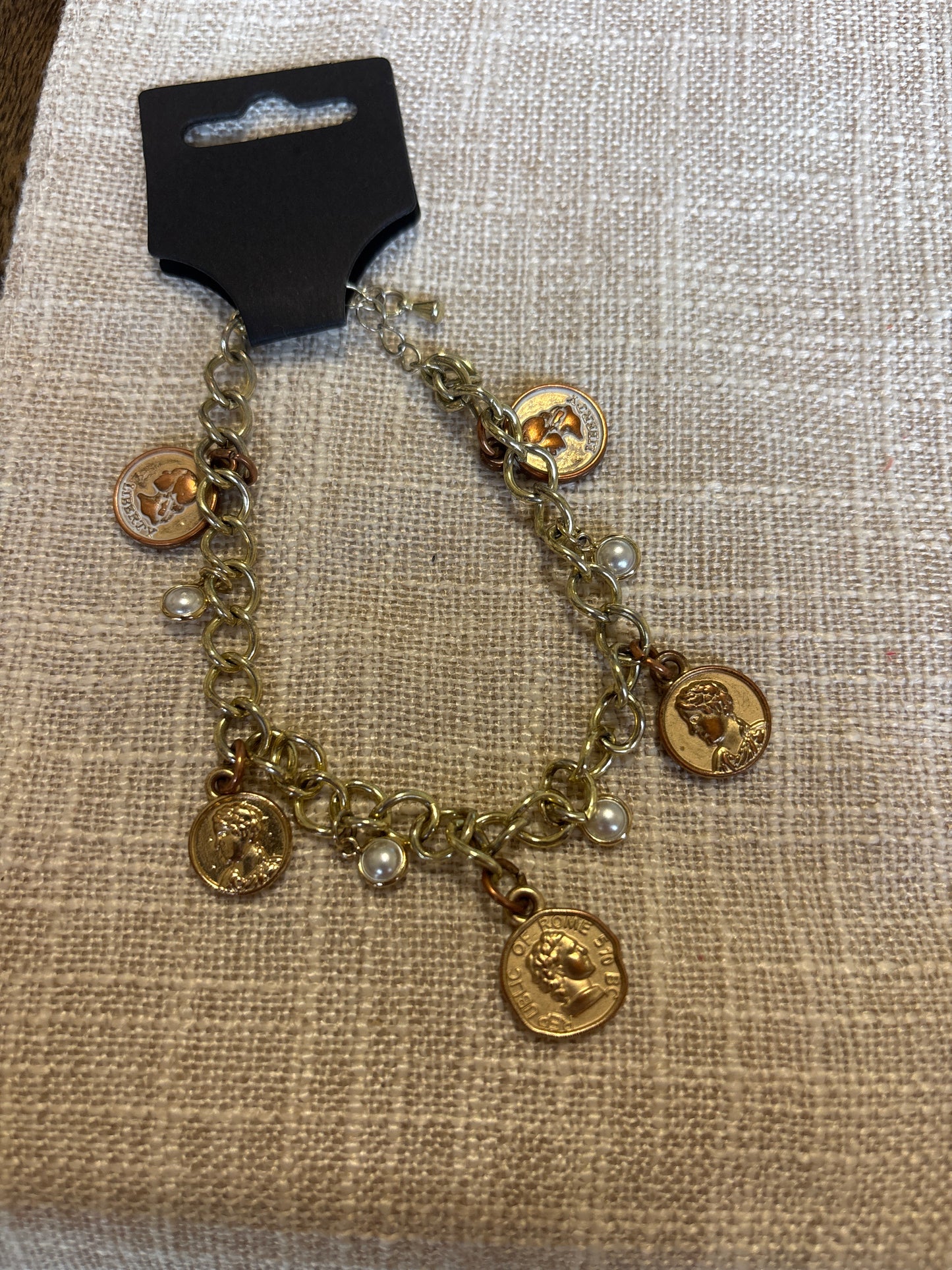 Coin charm bracelet
